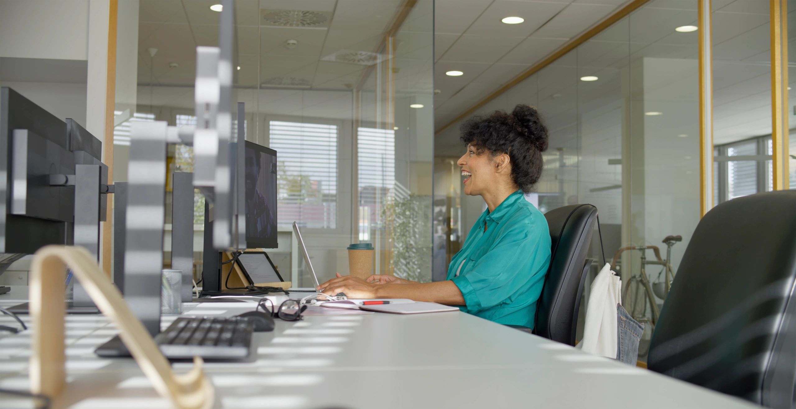 Customer service representative assisting clients from an office