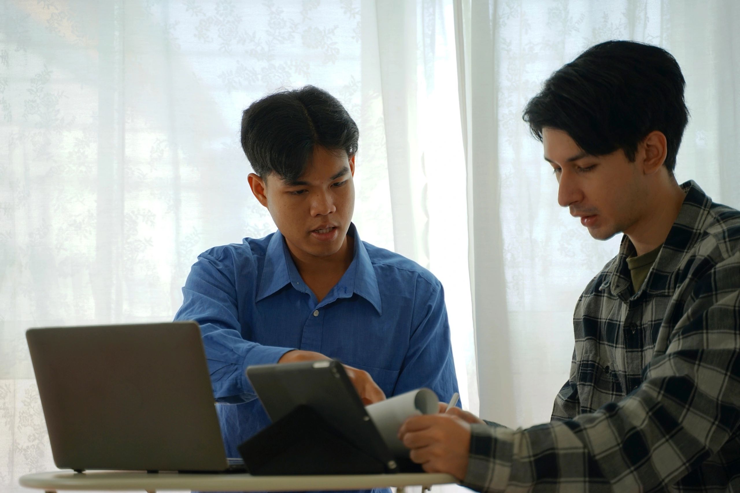 Finance professionals consulting together in an office